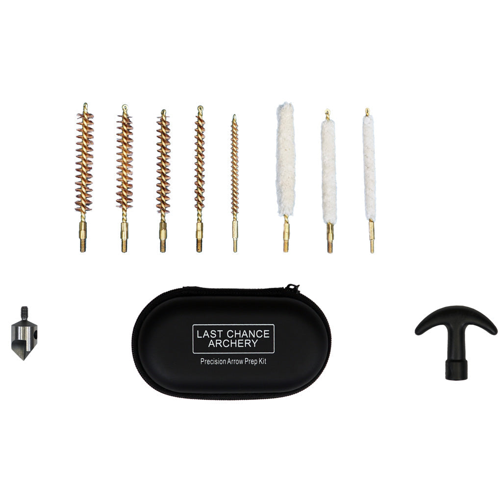 Arrow prep kit laid out on white — a row of brass bristle brushes and white felt swabs beside a black zip case and two small deburring tools.