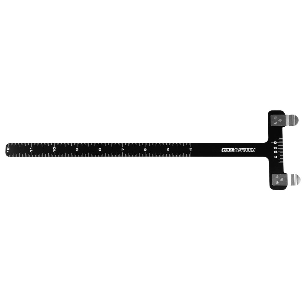 Black aluminum T-style bow square with an etched inch scale along the arm and two small brass string clamps, laid flat on a white background.